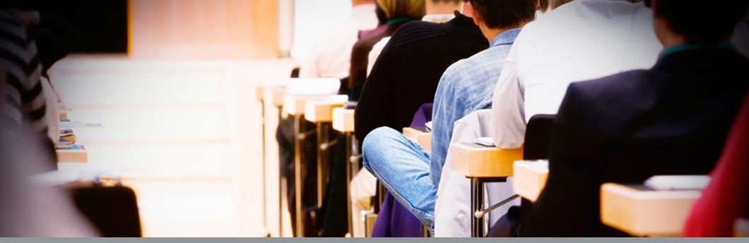 Back view of kids sitting in a lecture. mbbirdy/Getty Images